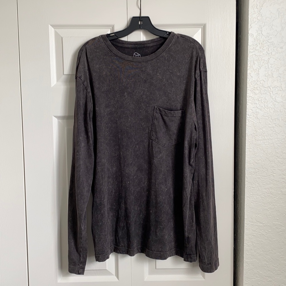 Long sleeve grey-ish shirt.